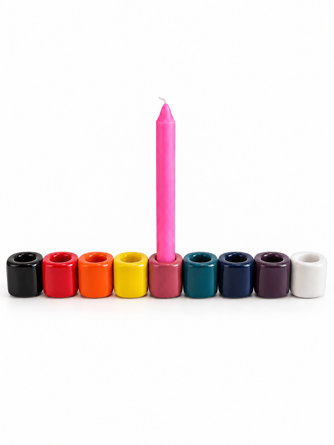 Set of four Sacred Light Soundbaths and Crystals ceramic candle holders with intricate designs and a glossy finish.