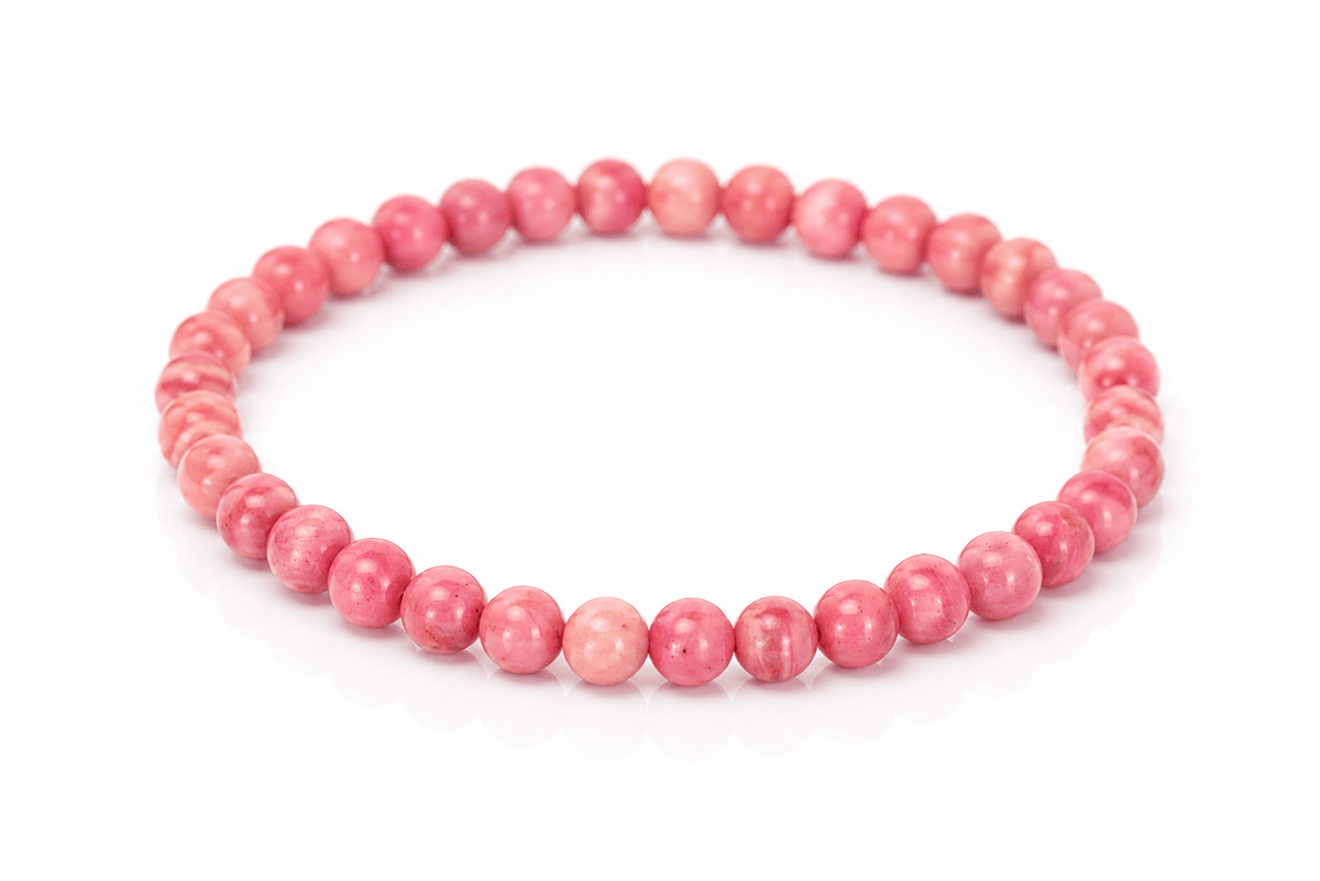 Dainty Rhodonite bracelet featuring polished pink and black stones, crafted by Milk and Honey jewelry brand.