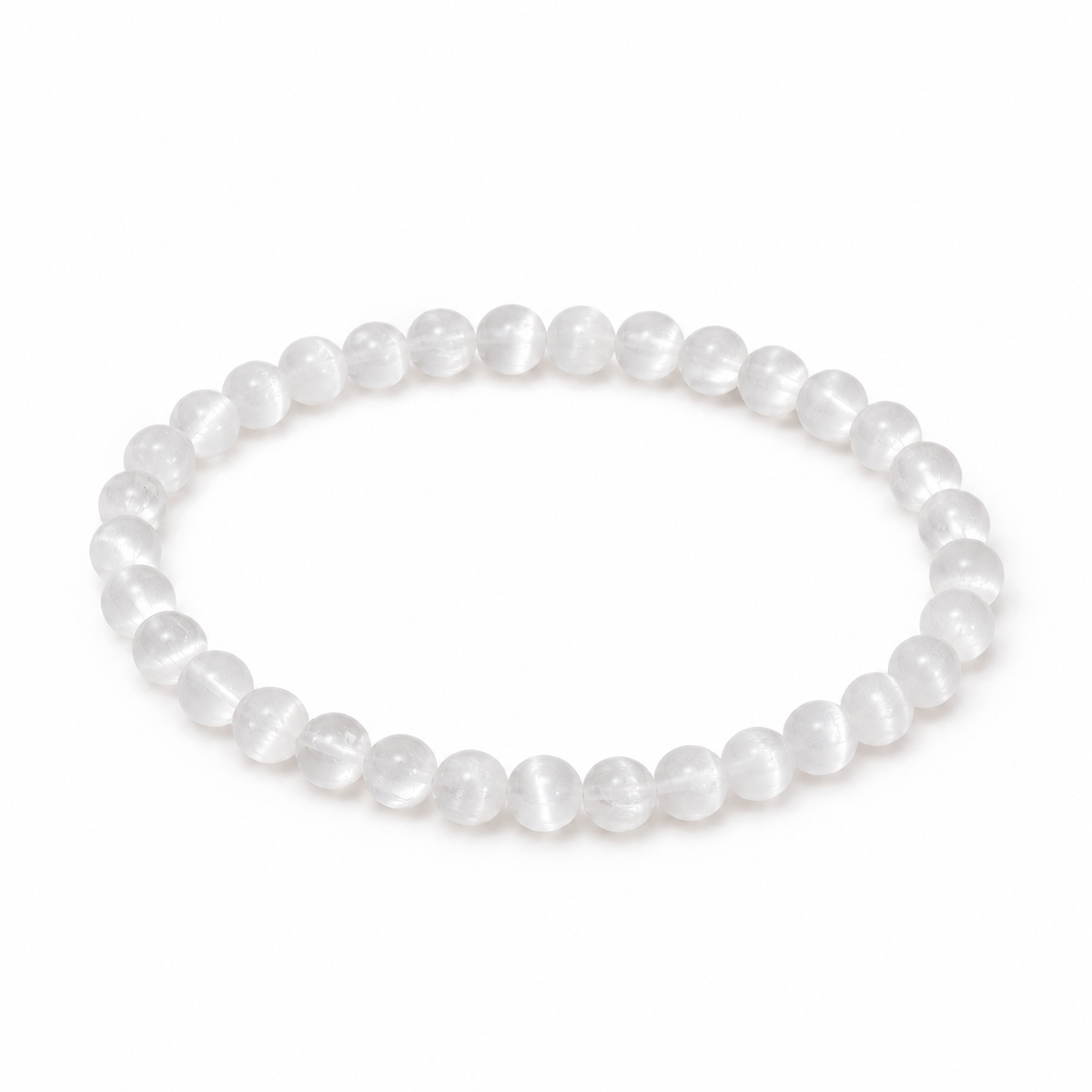 Dainty selenite bracelet by Milk and Honey featuring smooth, polished white gemstone beads on a delicate elastic band.