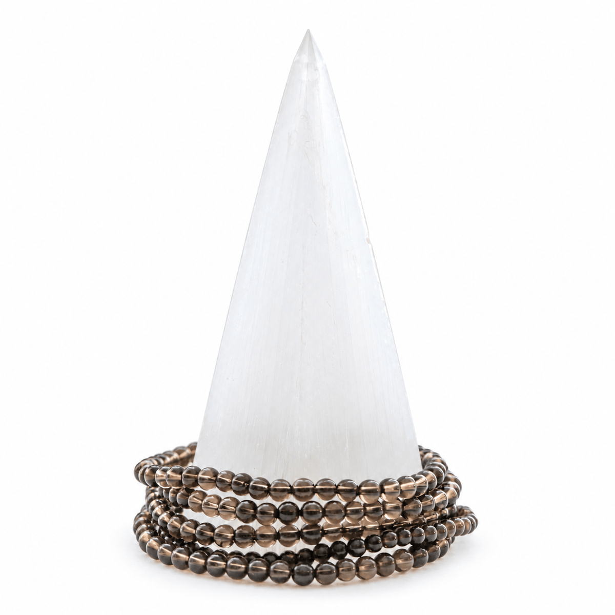 Dainty smoky quartz bracelet from Milk and Honey featuring polished, round smoky quartz beads on a delicate elastic band.