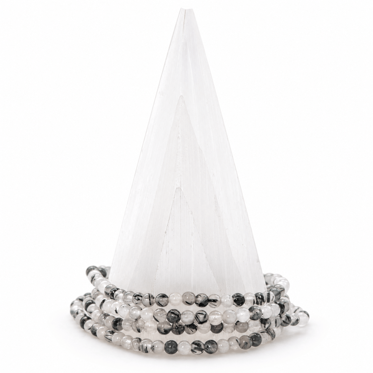 Dainty black tourmaline with clear quartz gemstone bracelet by Milk and Honey, featuring small polished stones on a delicate jewelry band.