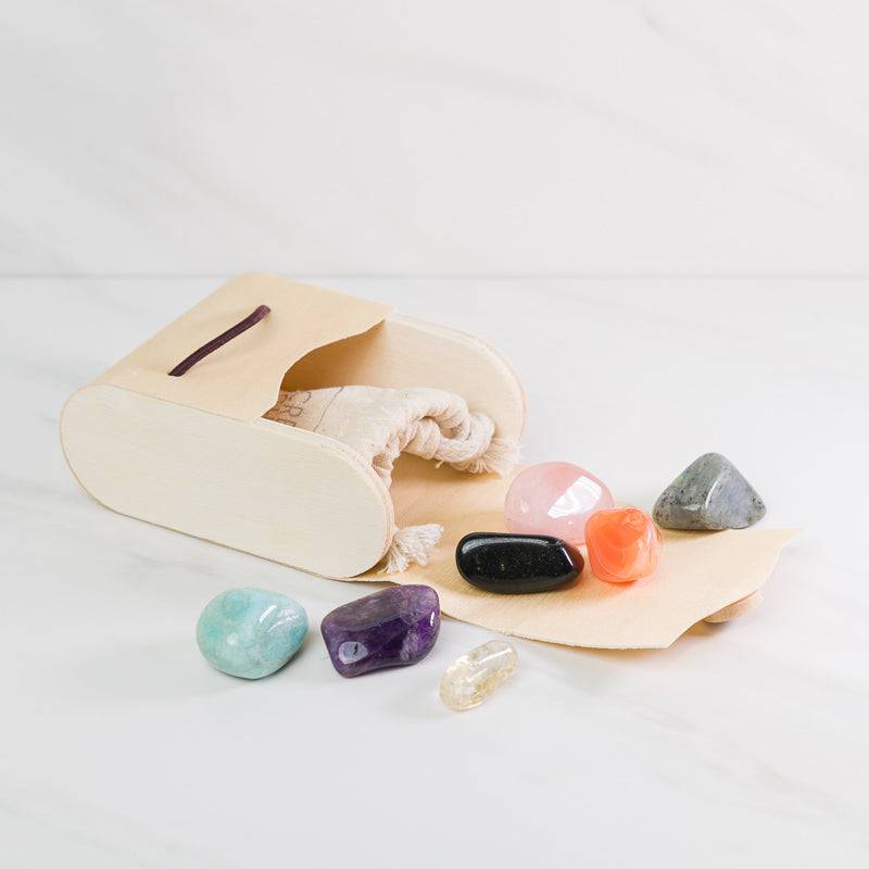 Large chakra alignment gemstone set in a wooden gift box, featuring colorful polished stones for energy balancing and healing.
