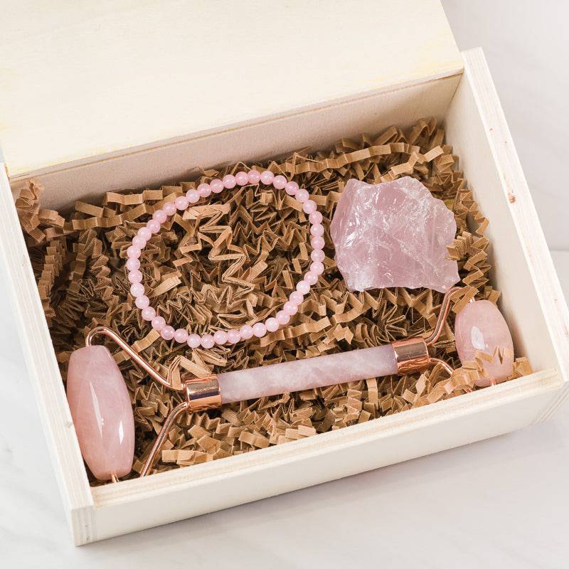 Sacred Light Soundbaths and Crystals Rose Quartz face massage roller set with dual rollers and soothing crystal accessories.