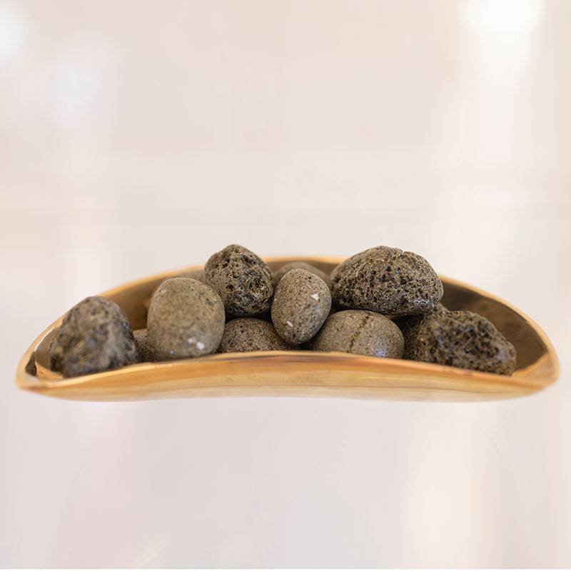 Tumbled Epidote stone from Sacred Light Soundbaths and Crystals, showing smooth green mineral with natural variations and polished surface.