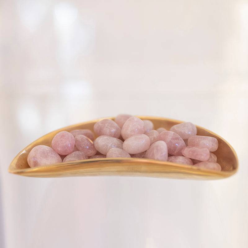 Tumbled lavender quartz stone from Sacred Light Soundbaths and Crystals, showcasing smooth, purple-hued mineral with a polished finish.
