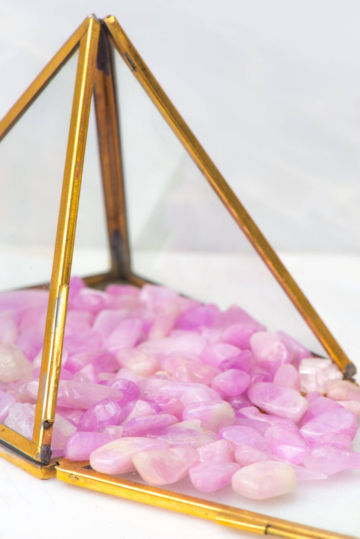 Kunzite tumbled stone from Sacred Light Soundbaths and Crystals, smooth pink crystal for healing and meditation.