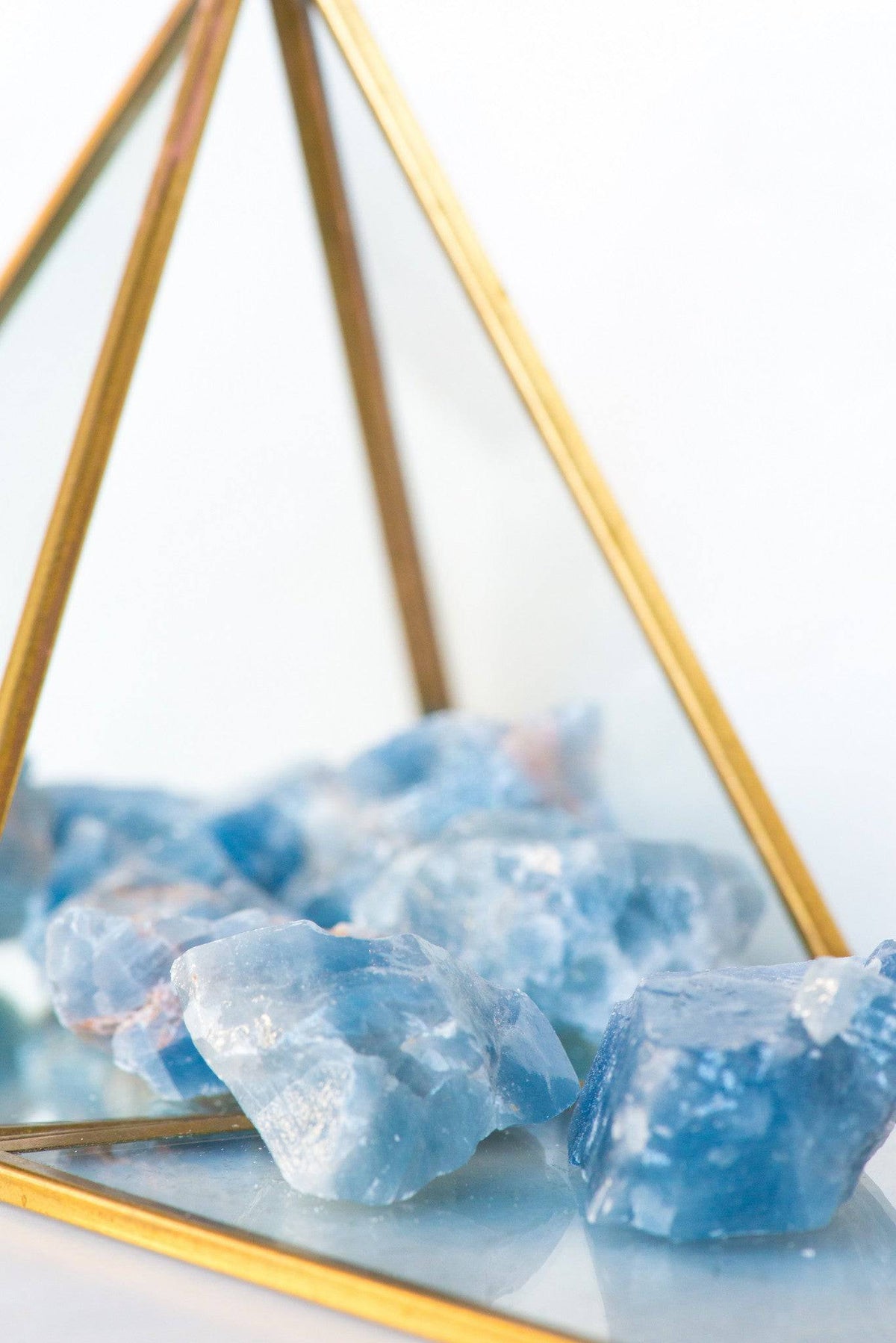 Natural blue calcite stone from Sacred Light Soundbaths and Crystals, showcasing its vibrant blue color and smooth polished surface.