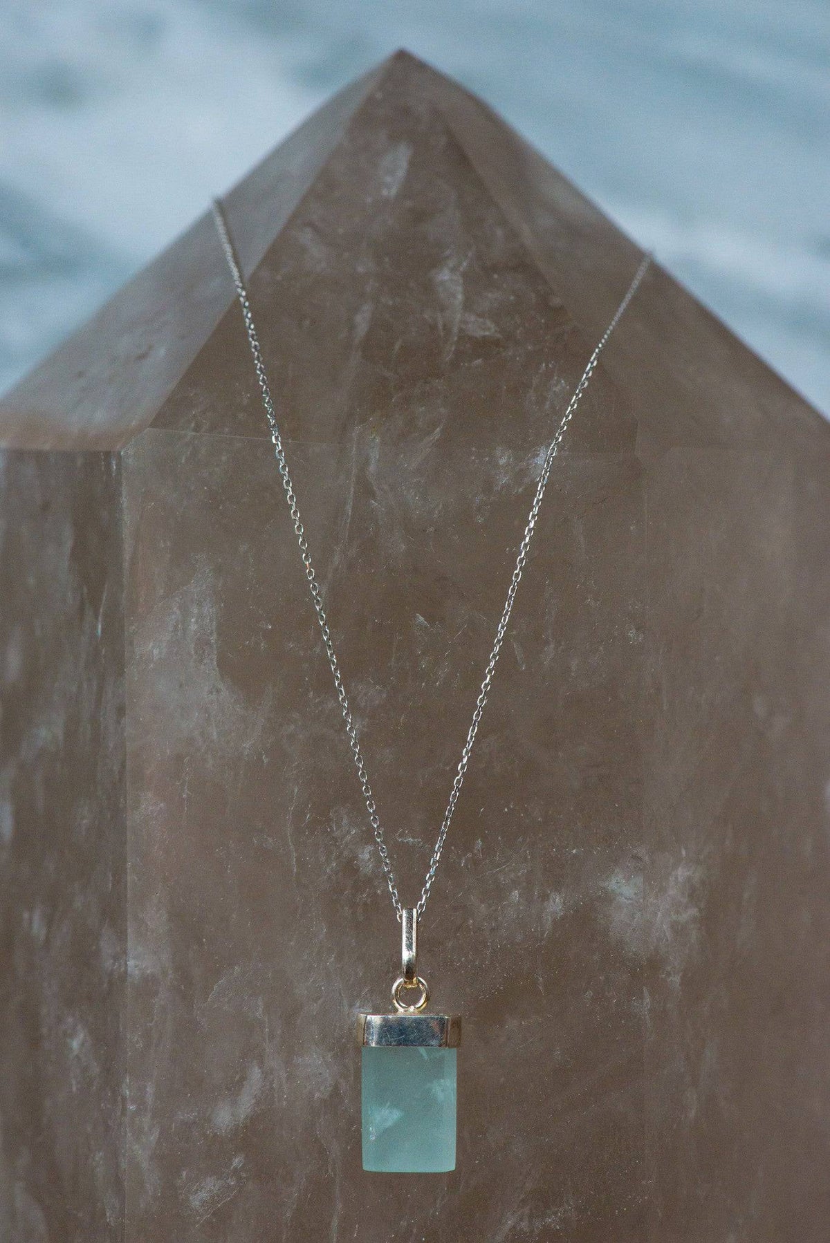 Sterling silver aquamarine necklace featuring a polished aquamarine gemstone pendant, crafted by Sacred Light Soundbaths and Crystals.