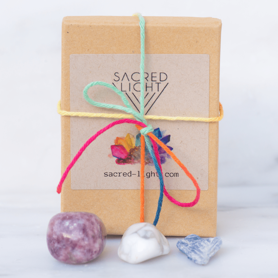 Sacred Light Soundbaths and Crystals anti-anxiety gem stone set featuring various polished gemstones arranged in a display.