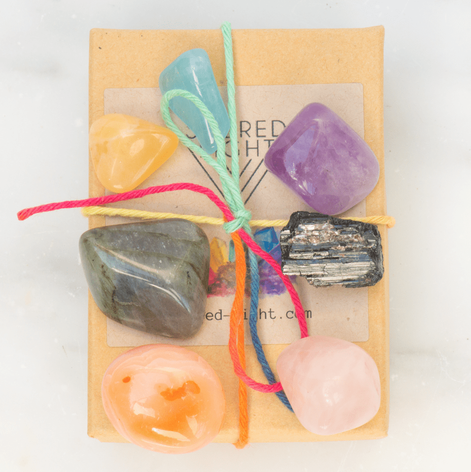 Small chakra alignment gem stone set featuring colorful polished crystals from Sacred Light Soundbaths and Crystals.