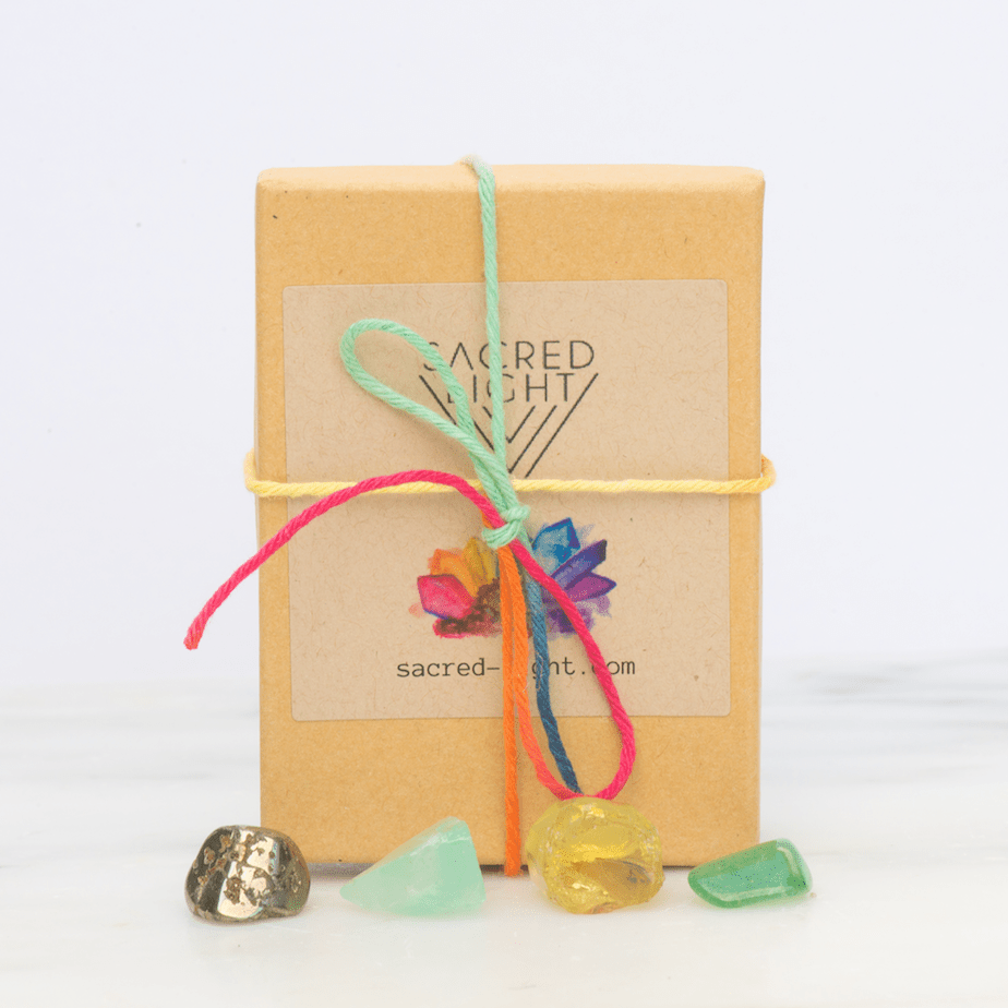 Sacred Light Soundbaths and Crystals Abundance Gem Stone Set featuring colorful polished gemstones on a white background.
