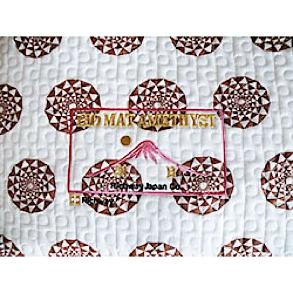 Biomat 7000MX single cotton pad for skin therapy or cleansing, featuring soft, absorbent cotton material.