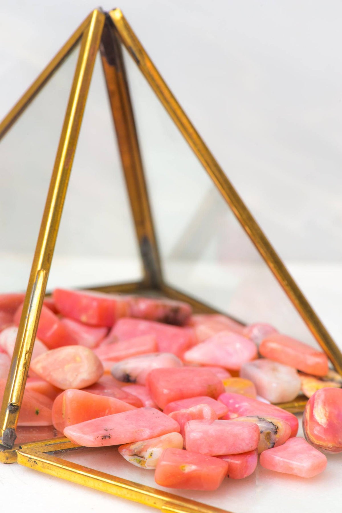 Pink Opal tumbled stone from Sacred Light Soundbaths and Crystals, showing smooth, polished pink gemstone with natural variations.