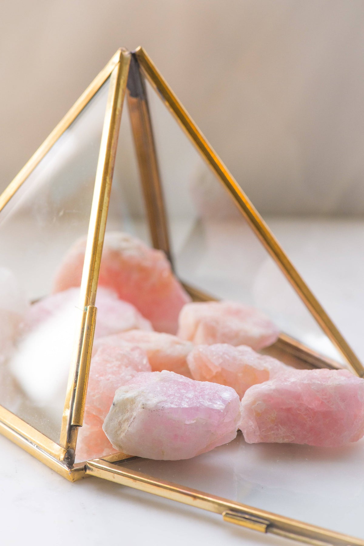 Natural Morganite gemstone from Sacred Light Soundbaths and Crystals, showcasing its soft pink hue and polished, smooth surface.