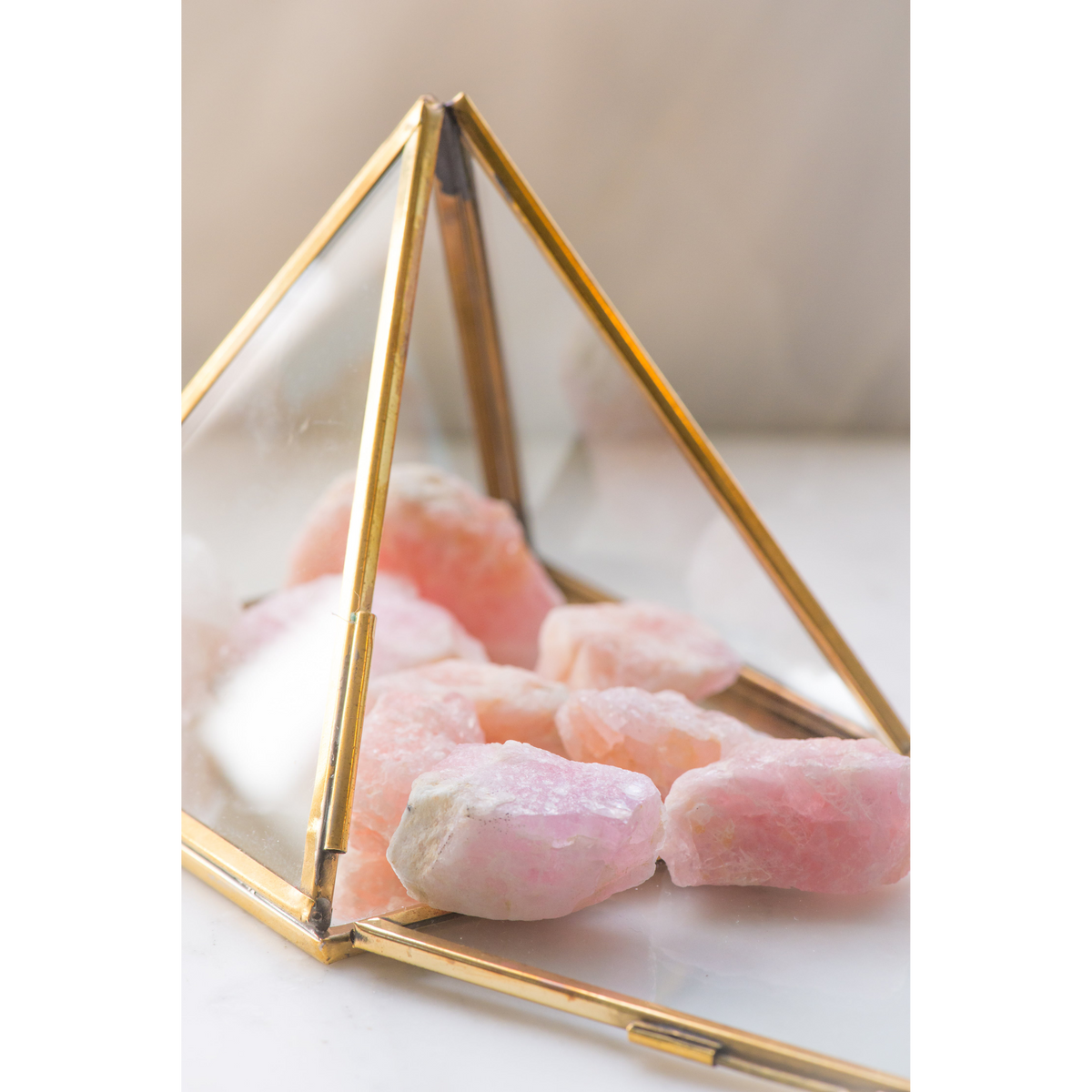 Natural Morganite gemstone from Sacred Light Soundbaths and Crystals, showcasing its soft pink hue and smooth faceted surface.