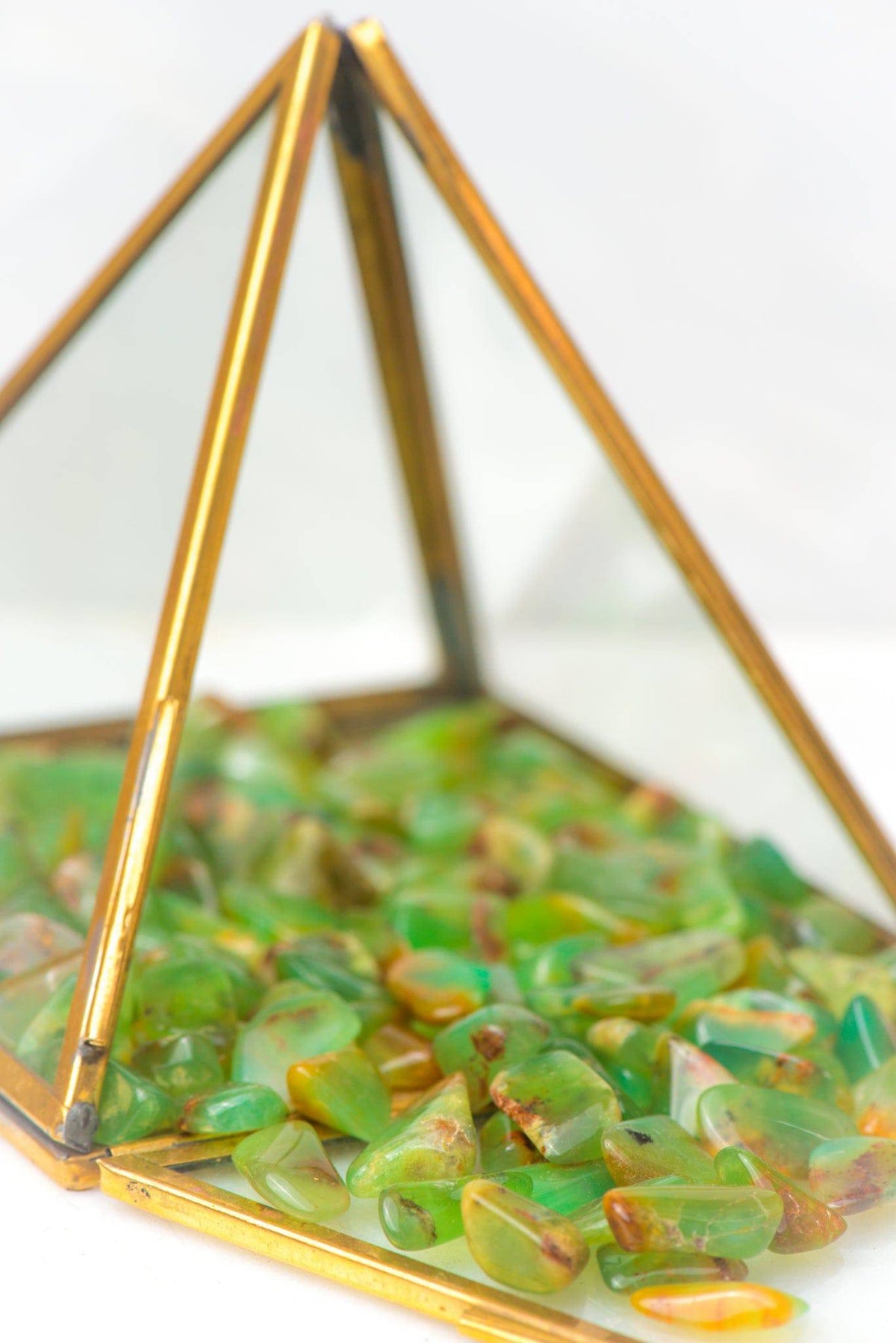 Small tumbled chrysoprase crystal from Sacred Light Soundbaths and Crystals, showcasing smooth, vibrant green stone with gentle natural patterns.