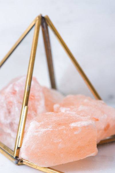 Natural Himalayan salt stones with pink crystalline texture, used for healing and relaxation, from Sacred Light Soundbaths and Crystals.