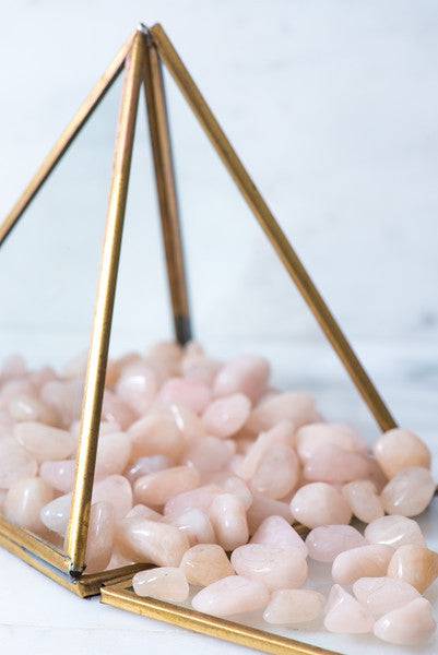 Small tumbled Morganite crystal stone from Sacred Light Soundbaths and Crystals, showcasing a soft pink hue and smooth polished surface.
