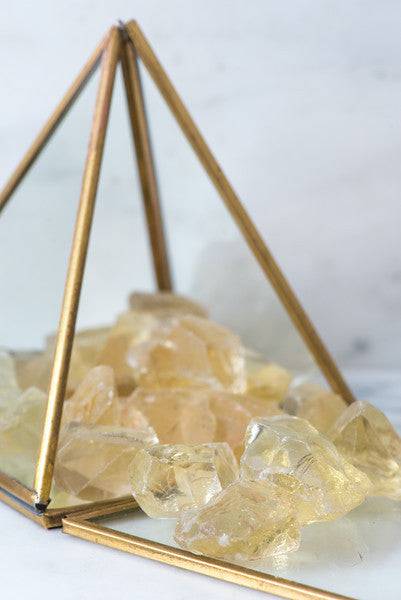 Natural Citrine stone from Sacred Light Soundbaths and Crystals, showing its vibrant yellow-orange color and polished surface.