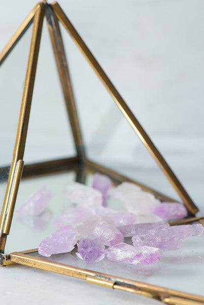 Natural Kunzite stone from Sacred Light Soundbaths and Crystals, showcasing its soft pink color and smooth polished surface.