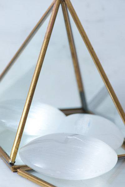 Selenite palm stone from Sacred Light Soundbaths and Crystals, smooth translucent crystal for meditation and healing.