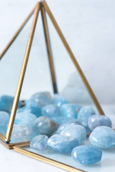 Tumbled Celestite stone from Sacred Light Soundbaths and Crystals, smooth blue mineral with natural veining and polished finish.