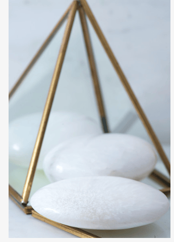 Polished Scolecite palm stone from Sacred Light Soundbaths and Crystals, smooth and translucent mineral healing stone.