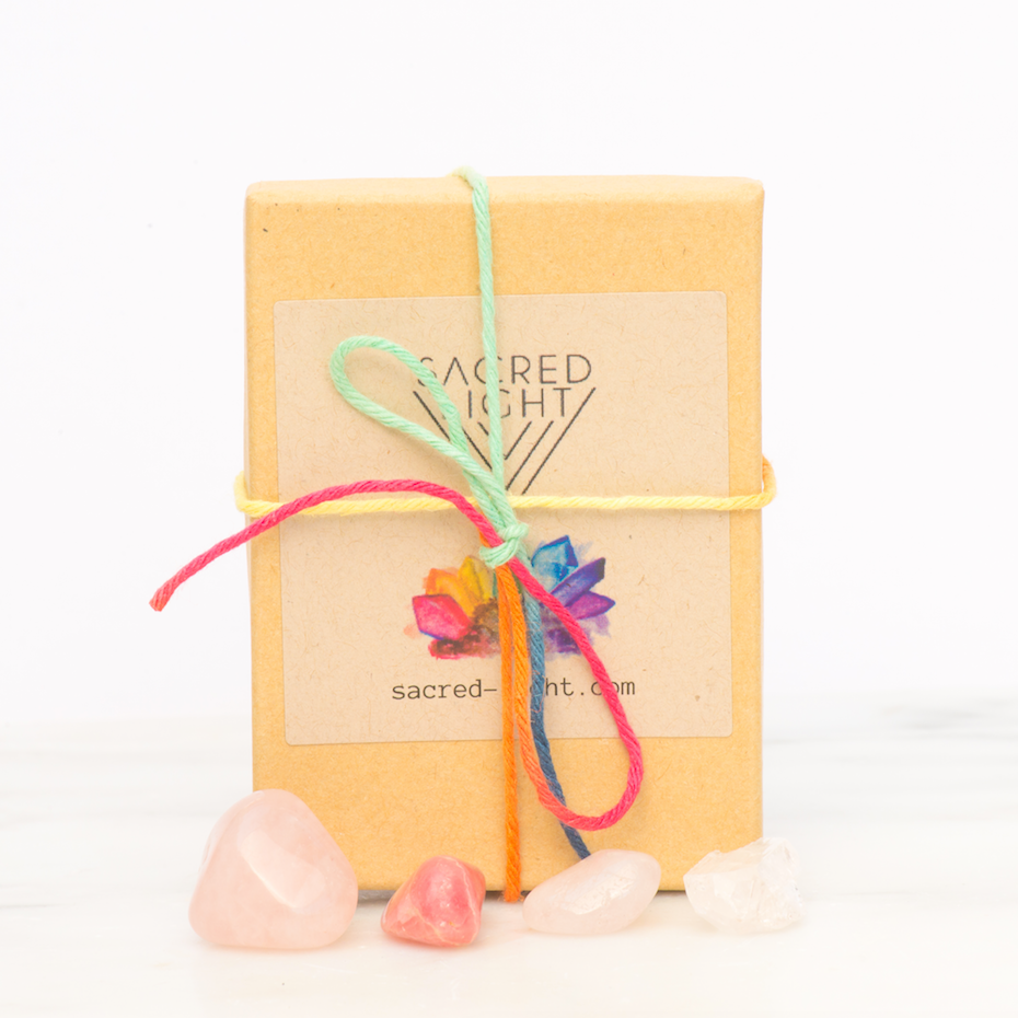 Sacred Light Soundbaths and Crystals love gemstone set featuring colorful polished stones arranged together.